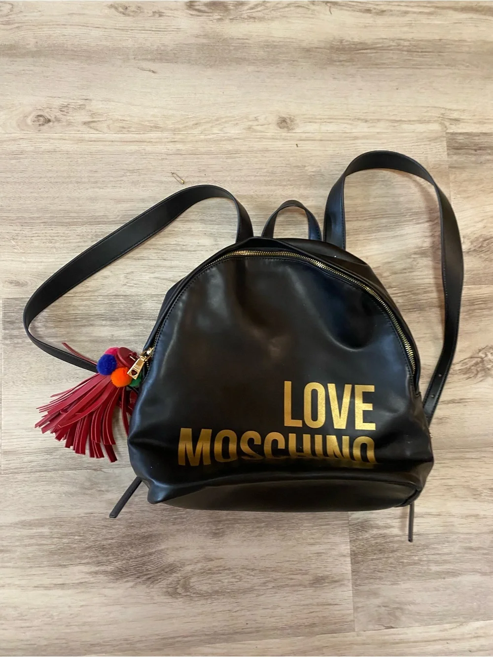 Love Moschino Black Backpack with Gold Logo and Red Tassel